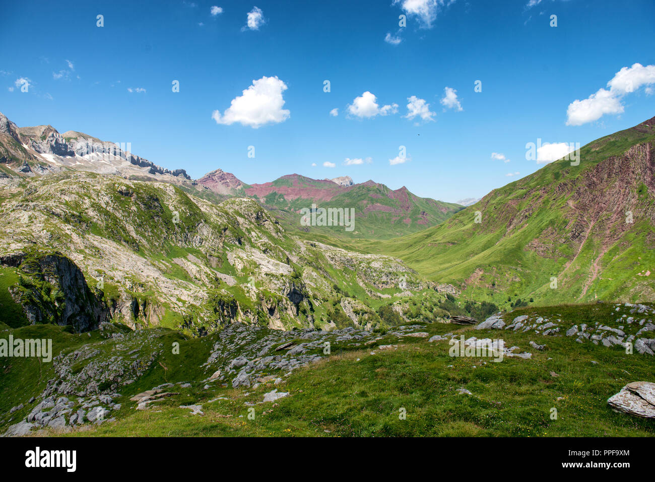 a mountain landscape with blue sky and clouds Stock Photo - Alamy