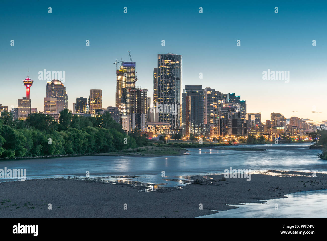 Night skyline of the city Calgary, Alberta, Canada along the Bow River Stock Photo
