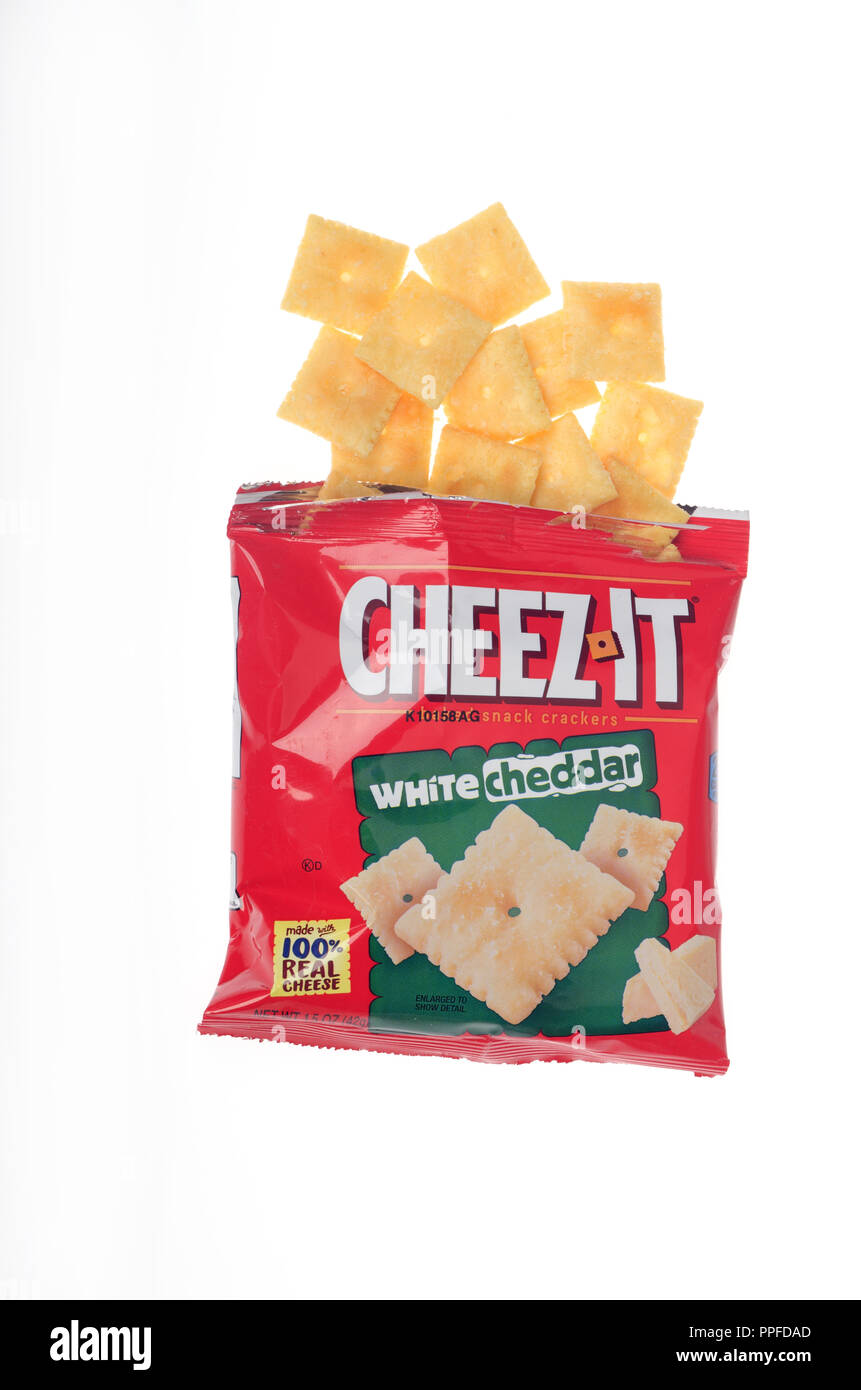 Cheez-It white cheddar cheese snack crackers packet with crackers spilling out Stock Photo