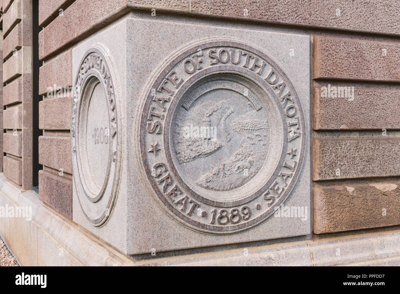 PIERRE, SD - JULY 9, 2018: State Seal of South Dakota on the cornerstone of the Capital Building in Pierre, SD Stock Photo