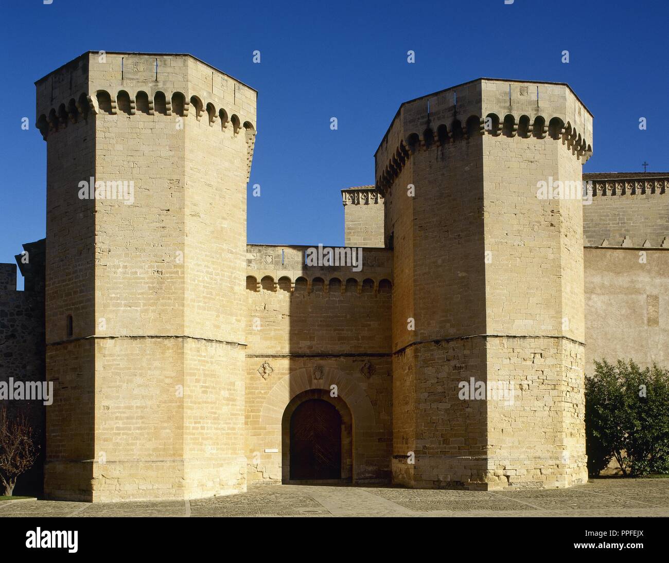 Spain, Catalonia, Tarragona province, Vimbodi. The Royal Abbey of Santa Maria de Poblet, a Cistercian monastery. Royal Gate, whose construction was ordered by Peter III el Ceremonios (Peter The Ceremonious, 1319-1387). Gothic style flanked by two octogonal towers. Stock Photo
