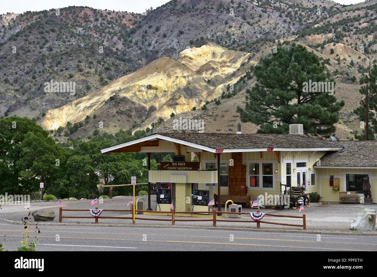 A gas station in Wyoming with a colourful cliff in background Stock