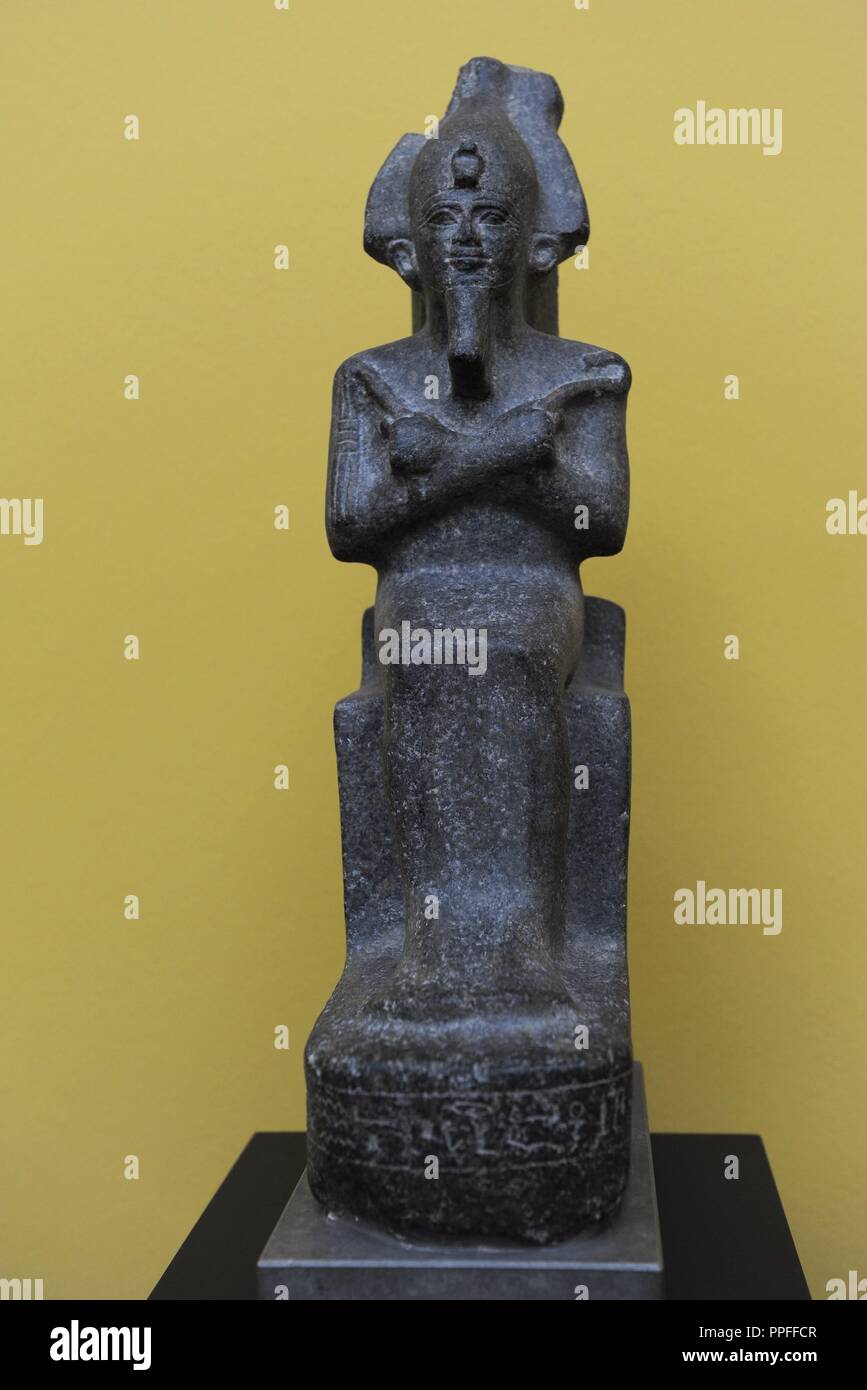 Statuette of Osiris wearing crown and royal scepters in their hands. Granite. C. 700 B.C. 25th Dynasty. Third Intermediate Period. Carlsberg Glyptotek Museum. Copenhagen. Denmark. Stock Photo