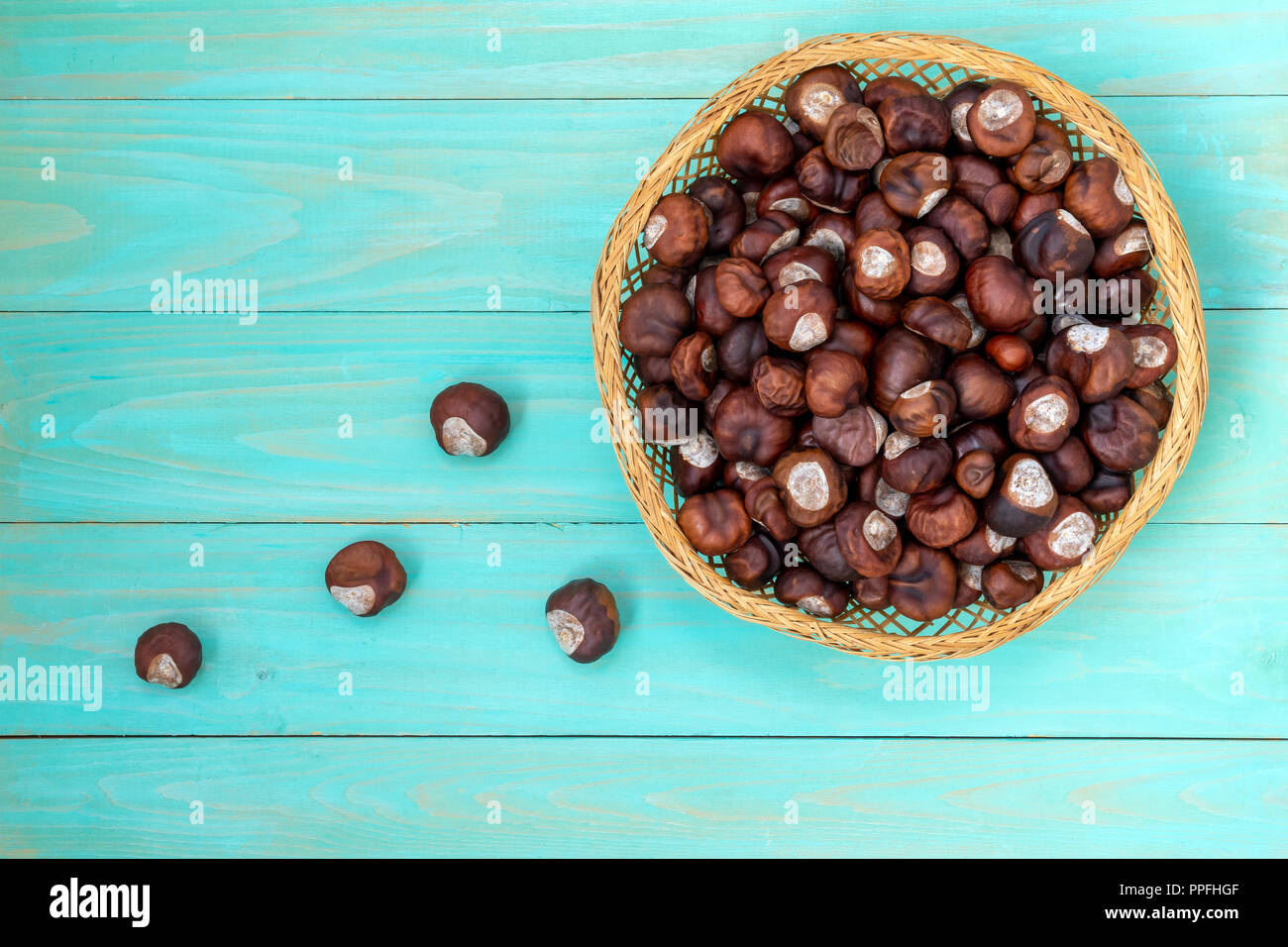 Wicker bowl full of horsechestnut,top view Stock Photo Alamy