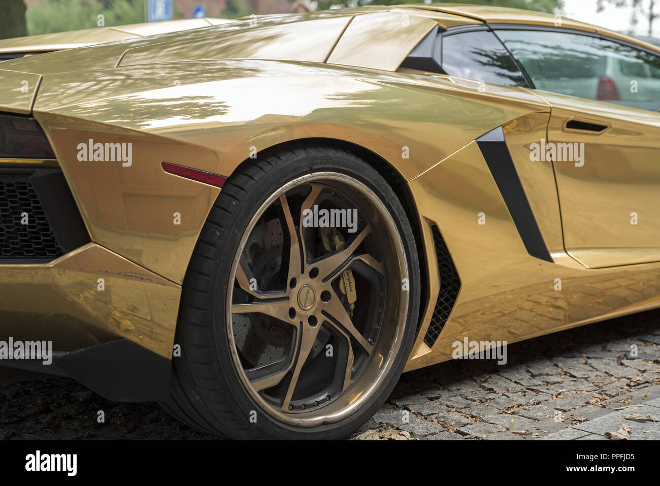 The beautiful Lamborghini is eye-catching on the streets of Krakow. Dreams  do not cost anything, and sometimes they meet. Golden car Stock Photo -  Alamy
