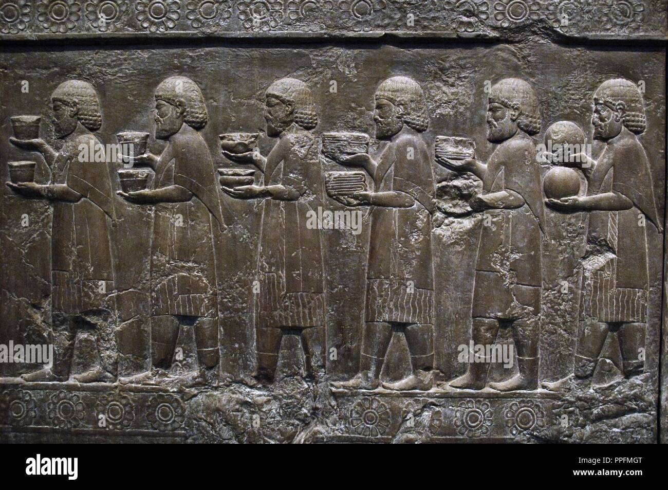 Palace of Darius I (522-486 BC). Reliefs of the outer wall of the staircase of the Apadana or Reception hall depicting Ionians in procession carrying offerings. Persepolis. Copy by the original preserved in their original place (Iran), 1892. British Museum. London. England. United Kingdom. Stock Photo