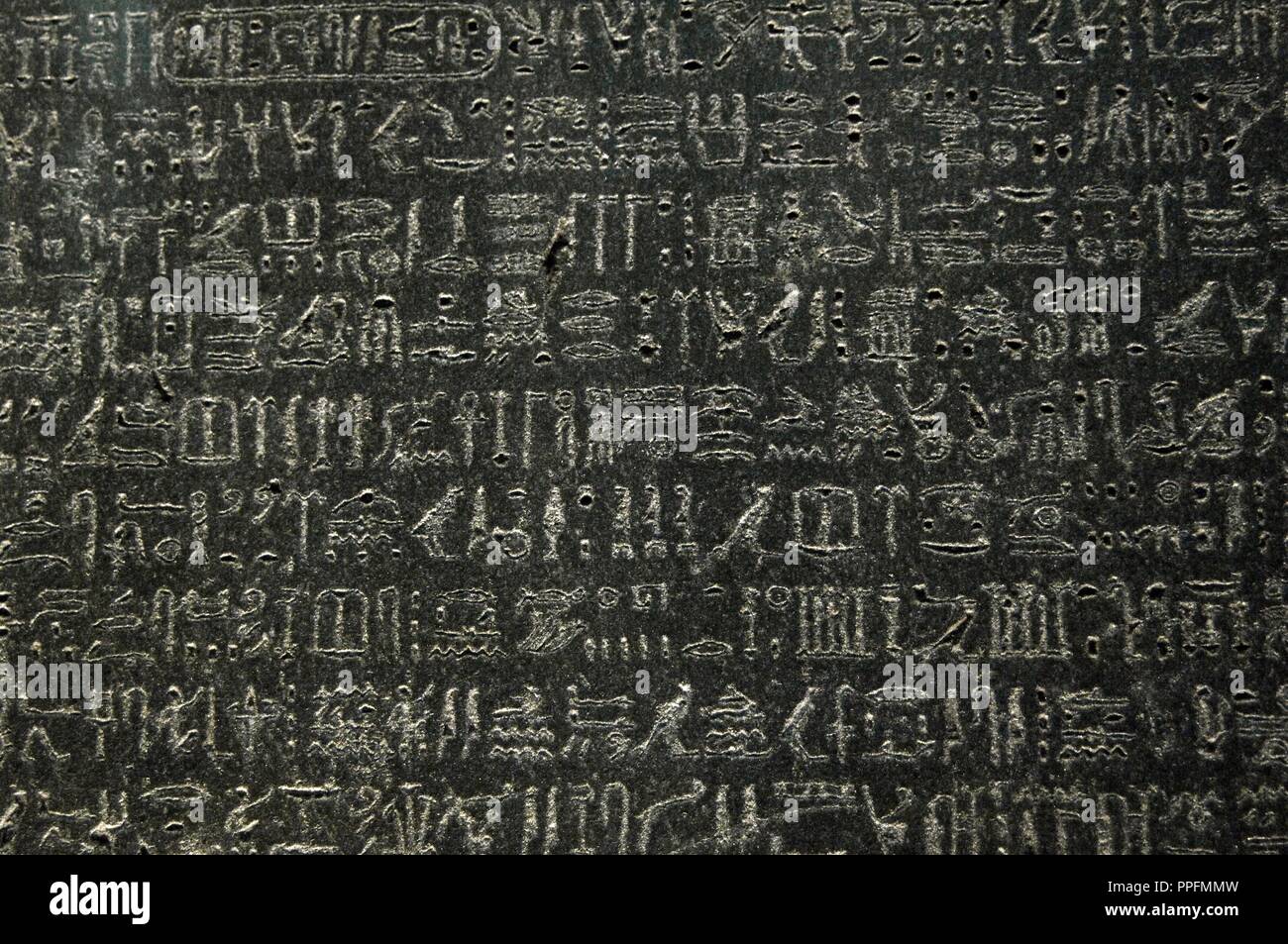 The Rosetta Stone. Fragment of a black granite stele with an