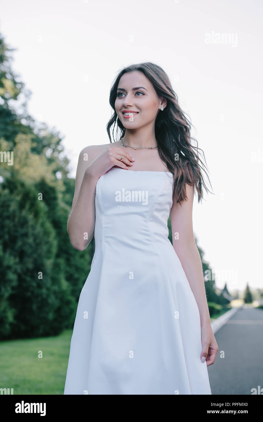 happy beautiful bride posing in traditional white wedding dress Stock ...