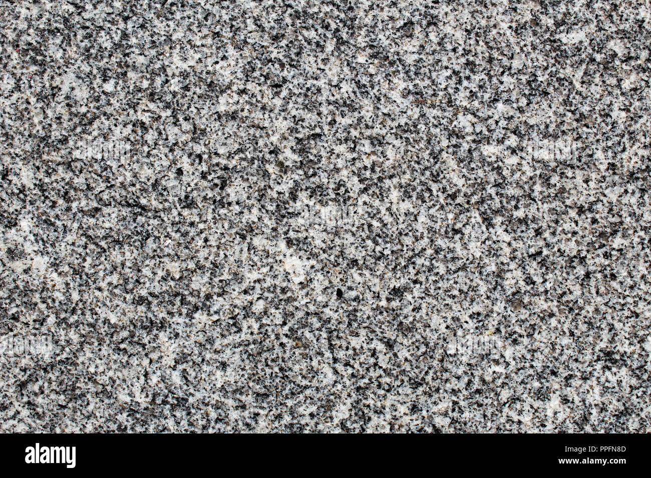 Fine-grained granite rock polished surface seen in detail Stock Photo