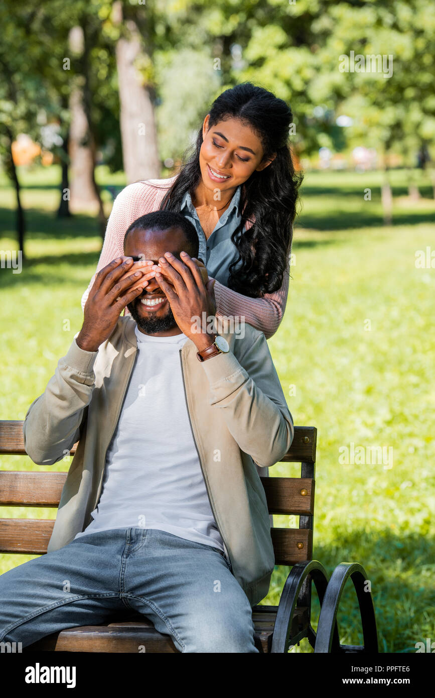African American Girlfriend Closing Boyfriend Eyes While He