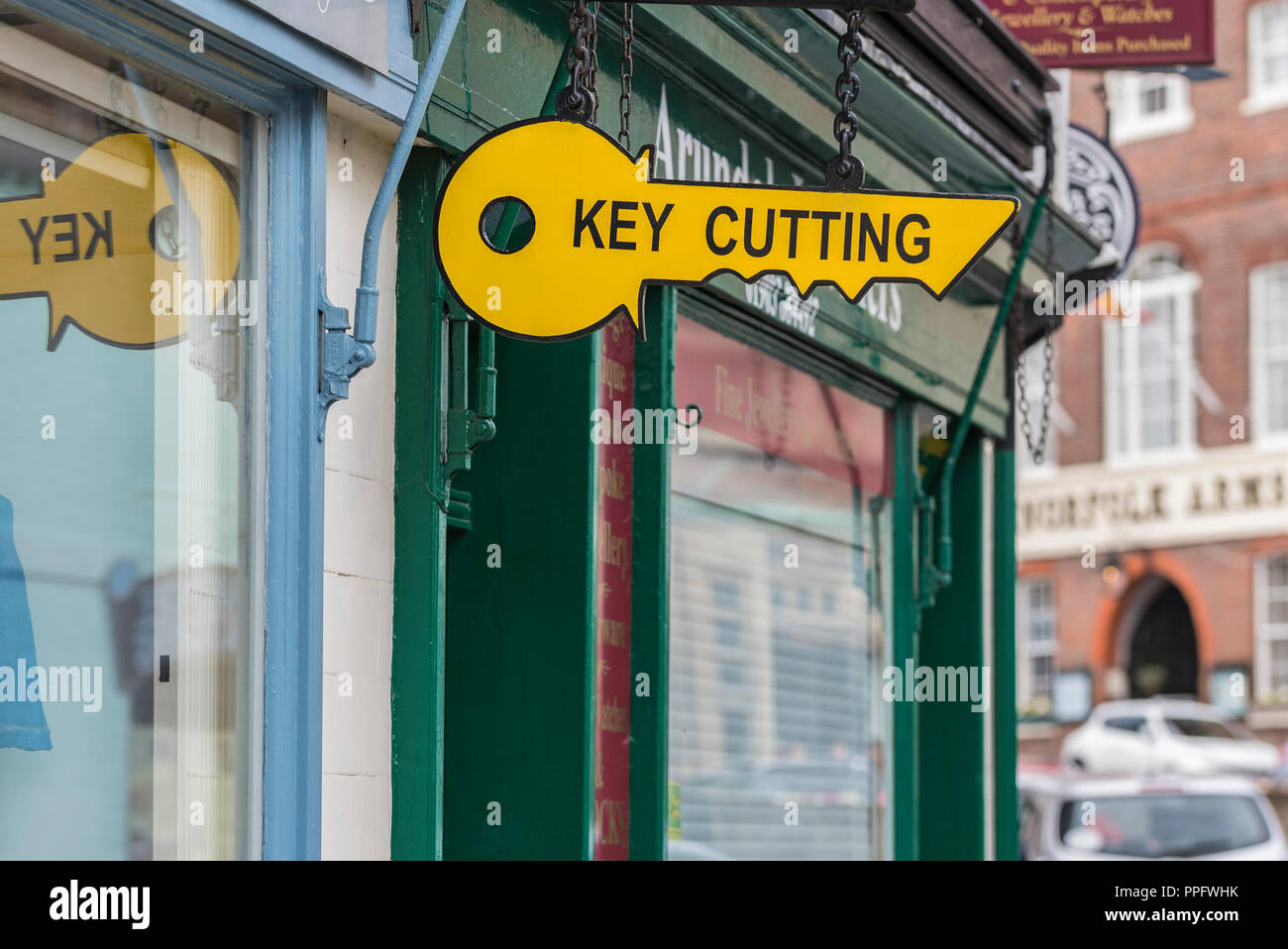 Hanging sign outside a key cutting shop in Arundel, West Sussex, England, UK. Stock Photo