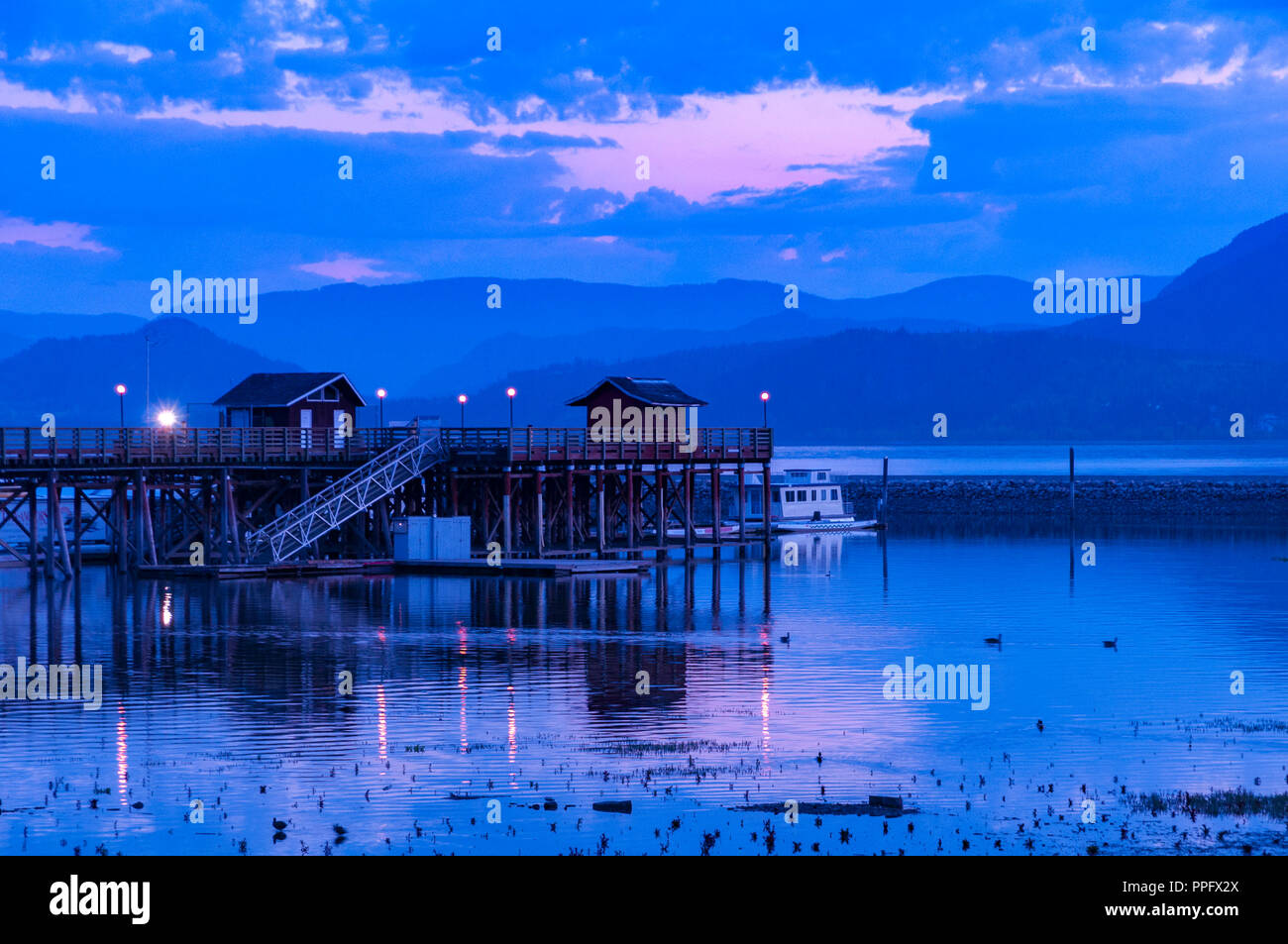 Pier on Shuswap Lake at dawn, near Salmon Arm, British Columbia, Canada