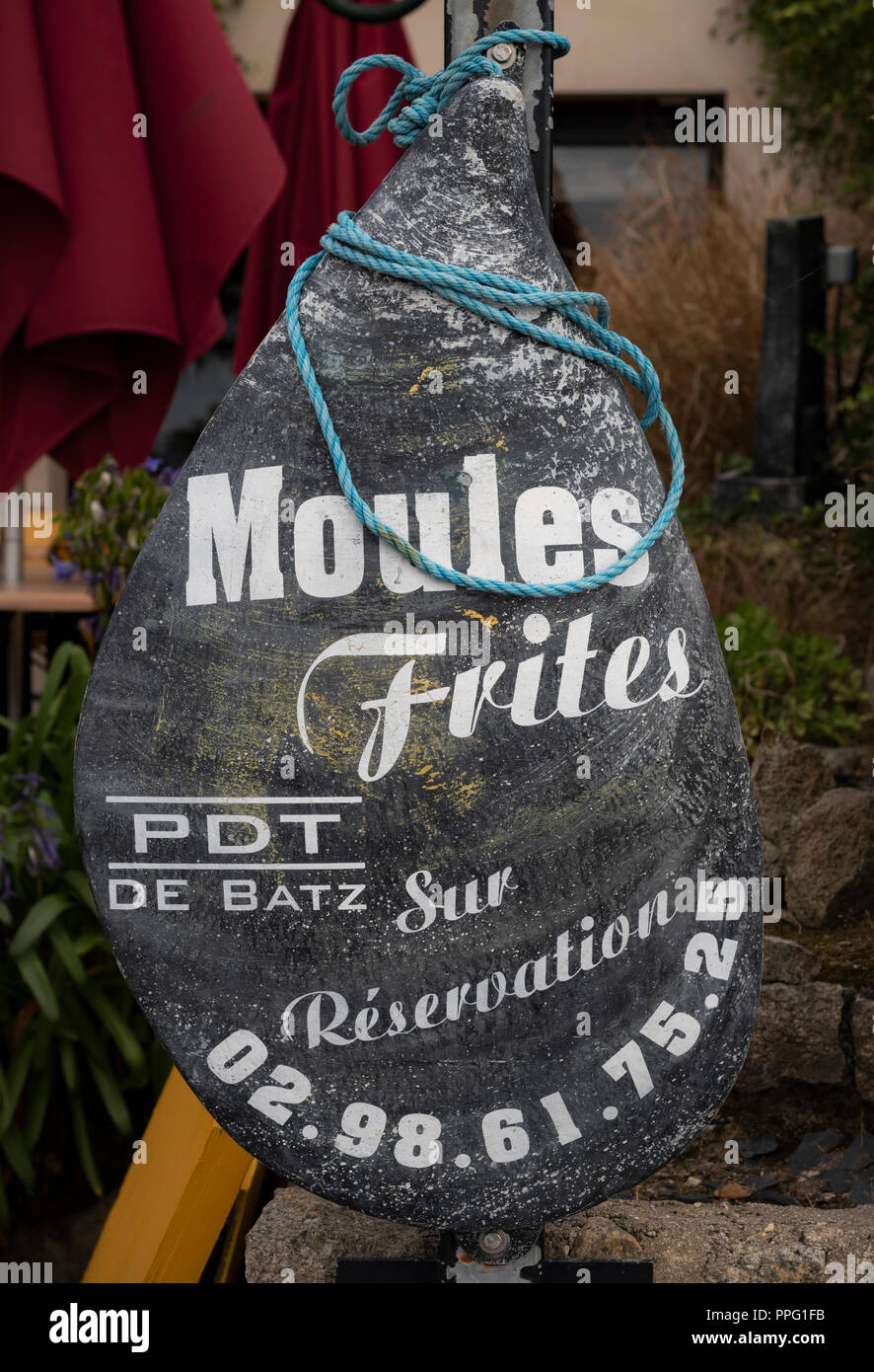 Sign outside restaurant advertising moules frites  Ile de Batz Roscoff Brittany France Stock Photo