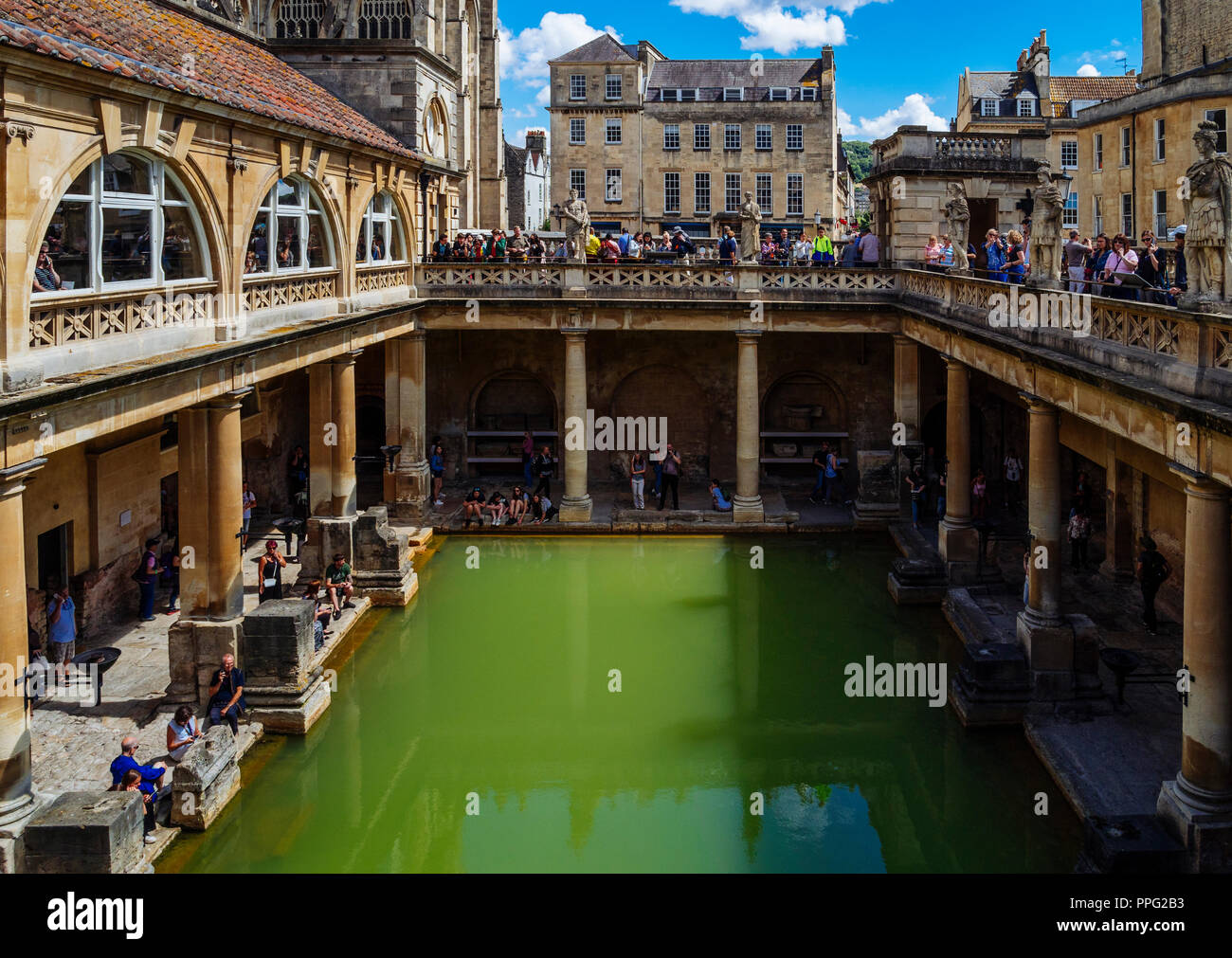 Visitors exploring the Terrace and Great Bath of the Roman Baths, in ...