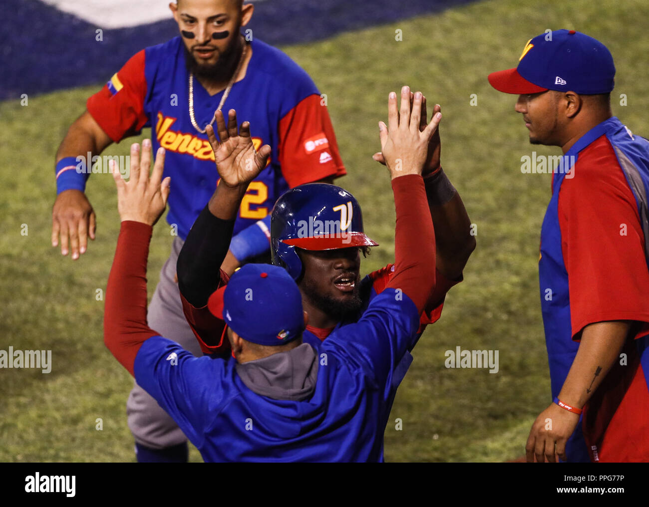 Odubel Herrera de Venezuela celebra la carrera del empate en el sexto inning  , durante el partido de desempate Italia vs Venezuela, World Baseball Cl Stock Photo