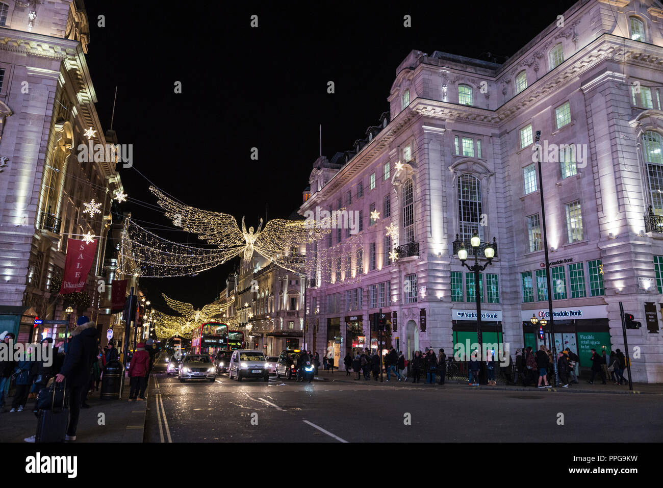 London, United Kingdom - January 3, 2018: Piccadilly Circus at night with Christmas decoration and people around in London, England, United Kingdom Stock Photo