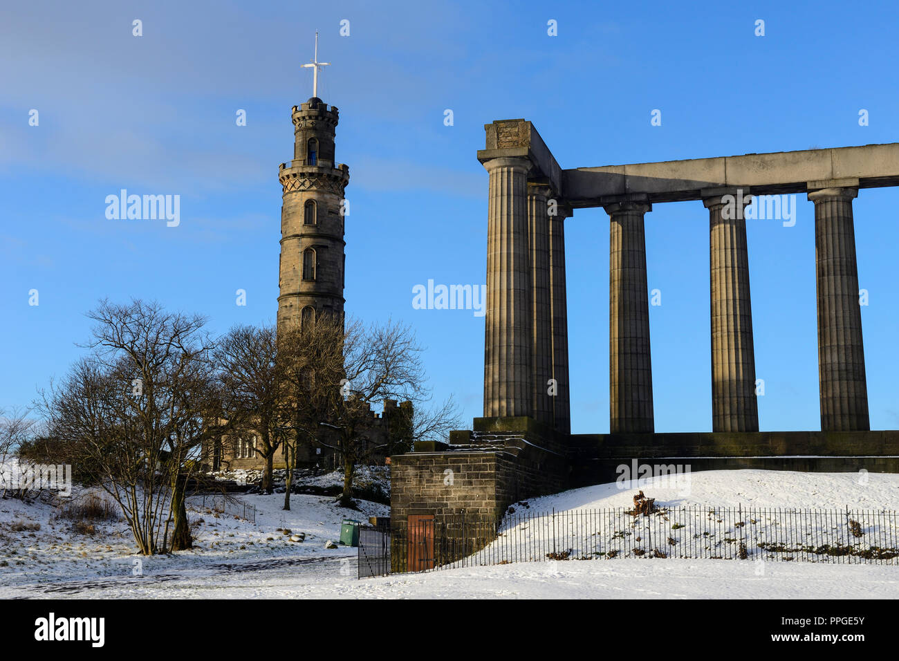 National Monument of Scotland and Nelson’s Monument on Calton Hill in the snow, Edinburgh, Scotland Stock Photo
