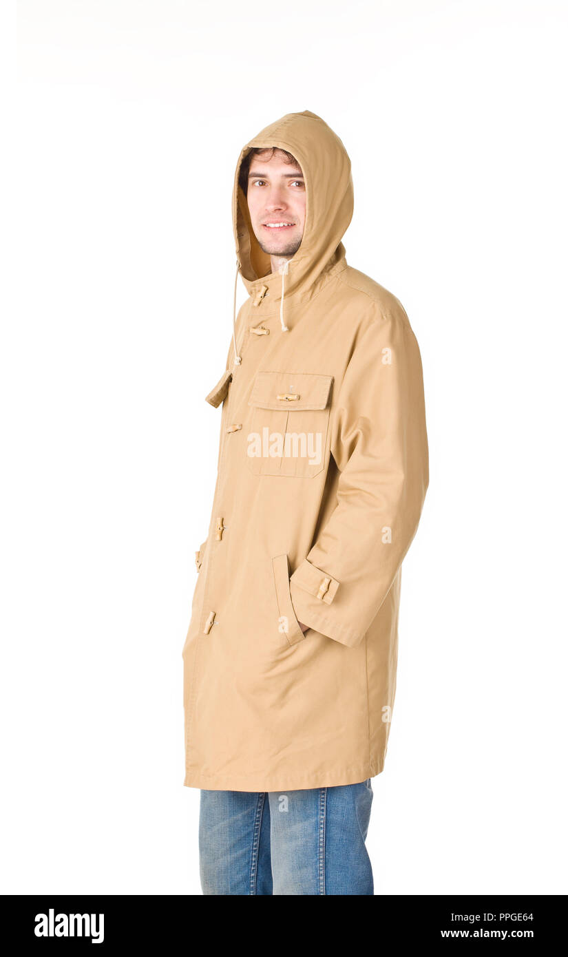 Man in raincoat with hood pointing hands in pockets Stock Photo - Alamy