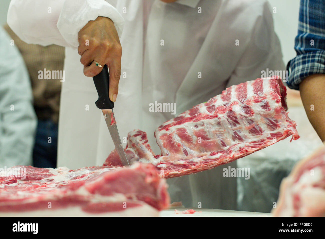 A free range pig is butchered during a demonstration for women butchers in Massachusetts Stock Photo