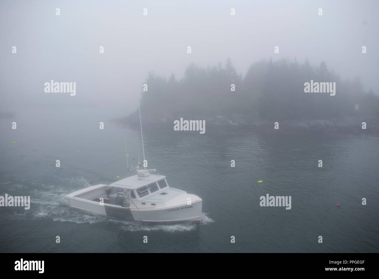 Lobster fishermen in their boats on the island of Vinalhaven, Maine
