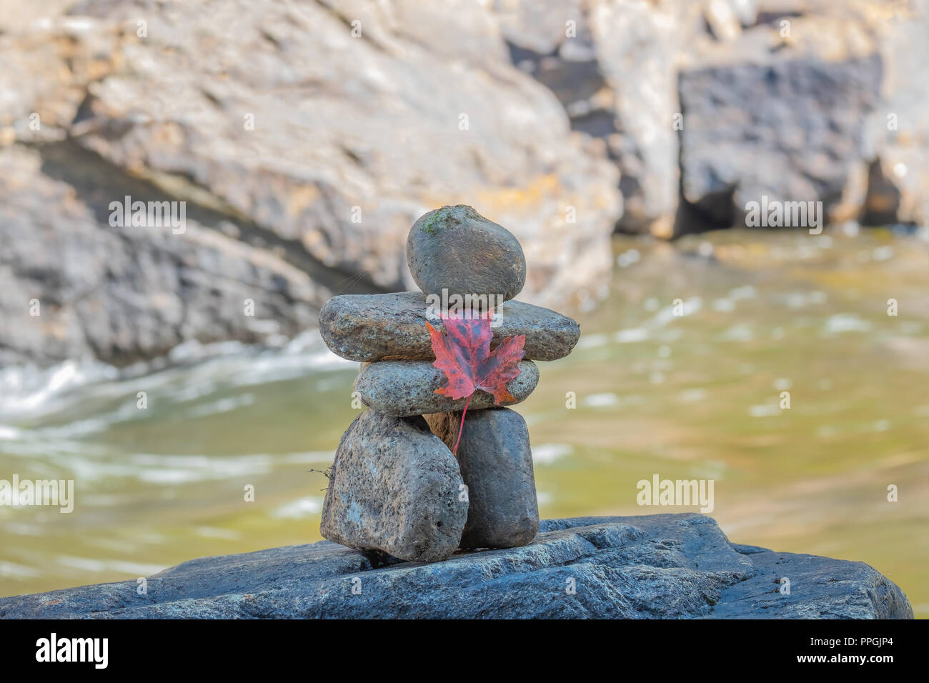 A traditional Inuit method of creating a navigational marker in areas with few natural landmarks, the inuksuk has become a symbol of Canada. Stock Photo