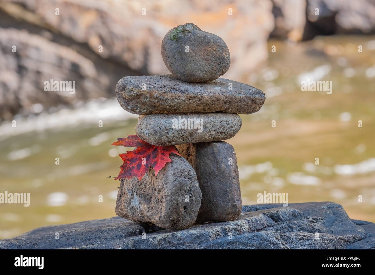 A traditional Inuit method of creating a man made marker in areas of few natural landmarks, the inuksuk has become a national symbol of Canada. Stock Photo