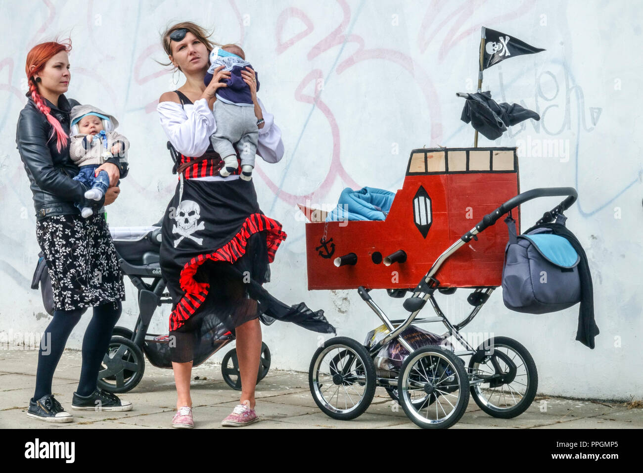 Alternative Mothers with Babies and Pirated Children's Pram, Prague Holesovice, Czech Republic Stock Photo