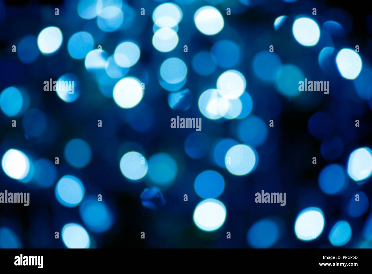 Blurry background image of defocused blue abstract city street lights at night Stock Photo