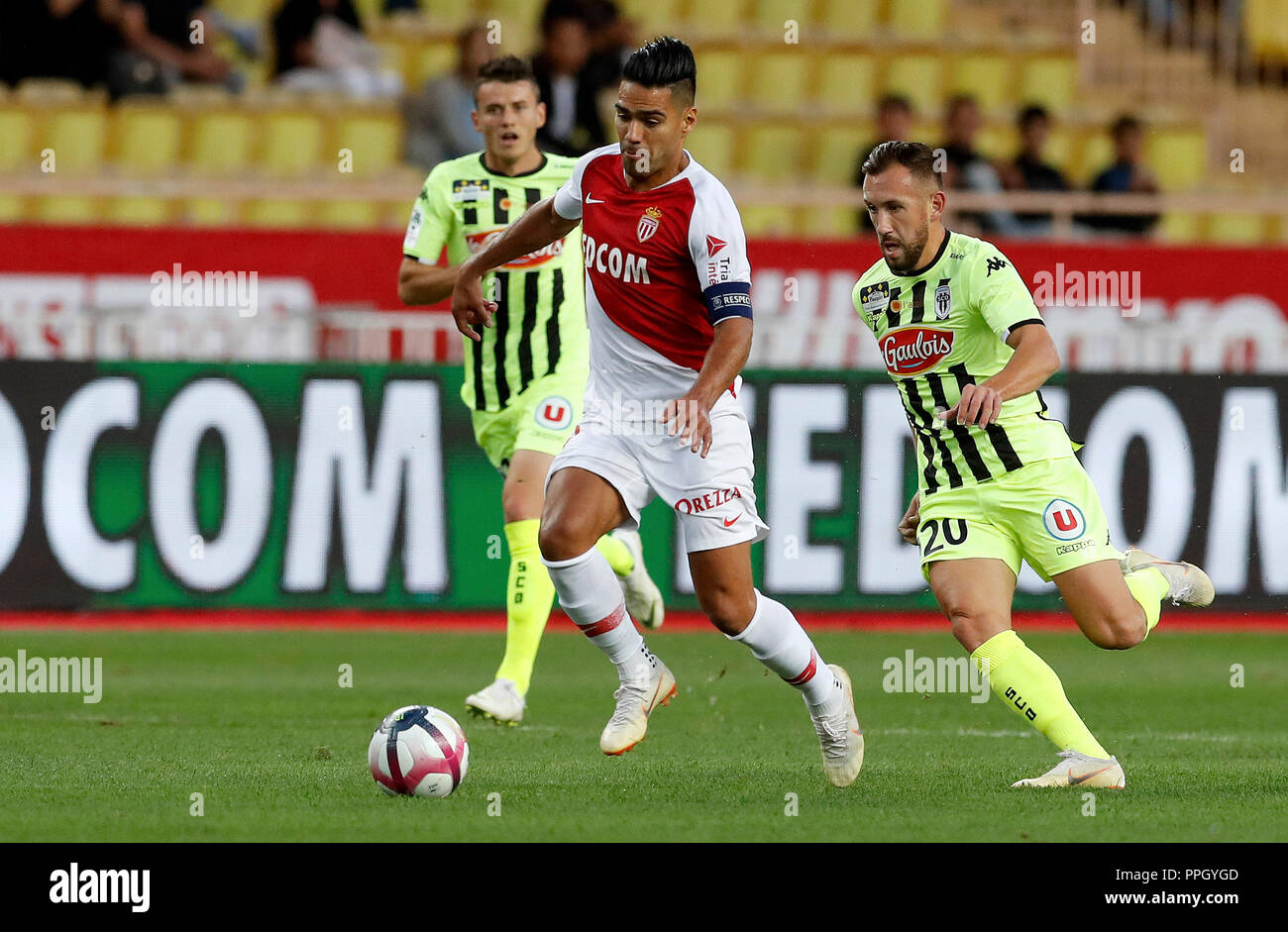 Fontvieille. 25th Sep, 2018. Flavien Tait (R) of Angers vies with Radamel Falcao of Monaco during the French Ligue 1 seventh round match between Angers and Monaco in Fontvieille, Monaco on Sept. 25, 2018. Angers won 1-0. Credit: Marco Fino/Xinhua/Alamy Live News Stock Photo