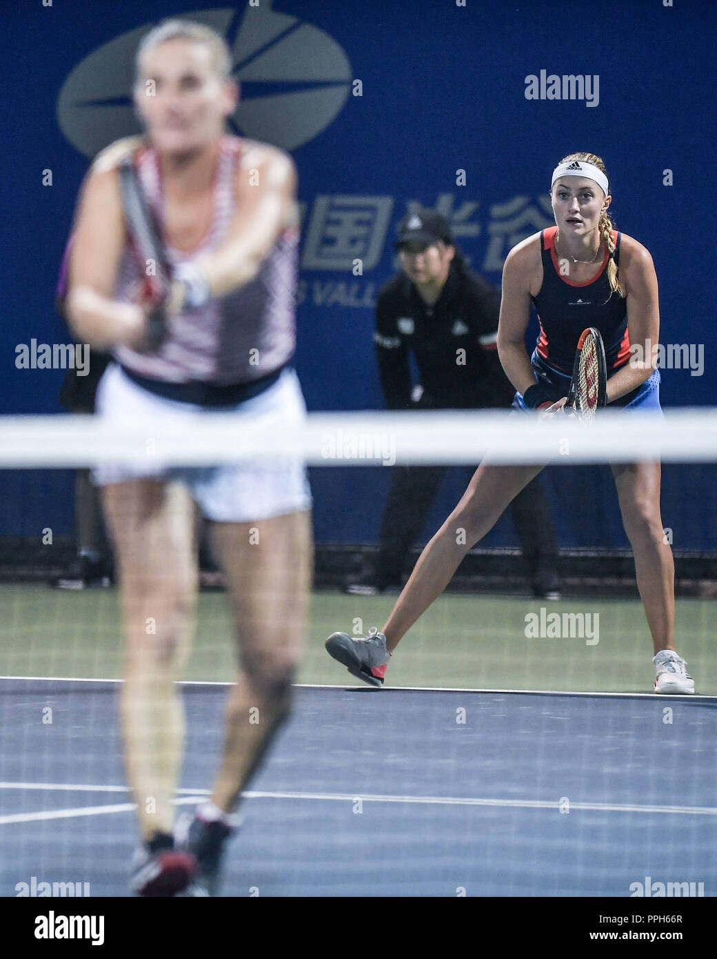 Wuhan. 26th Sep, 2018. Timea Babos (L) of Hungary and Kristina Mladenovic of France compete during doubles second round match against Kaitlyn Christian and Sabrina Santamaria of the United States at the 2018 WTA Wuhan Open tennis tournament in Wuhan of central China's Hubei Province, on Sept. 26, 2018. Babos and Mladenovic won 2-0. Credit: Xue Yubin/Xinhua/Alamy Live News Stock Photo