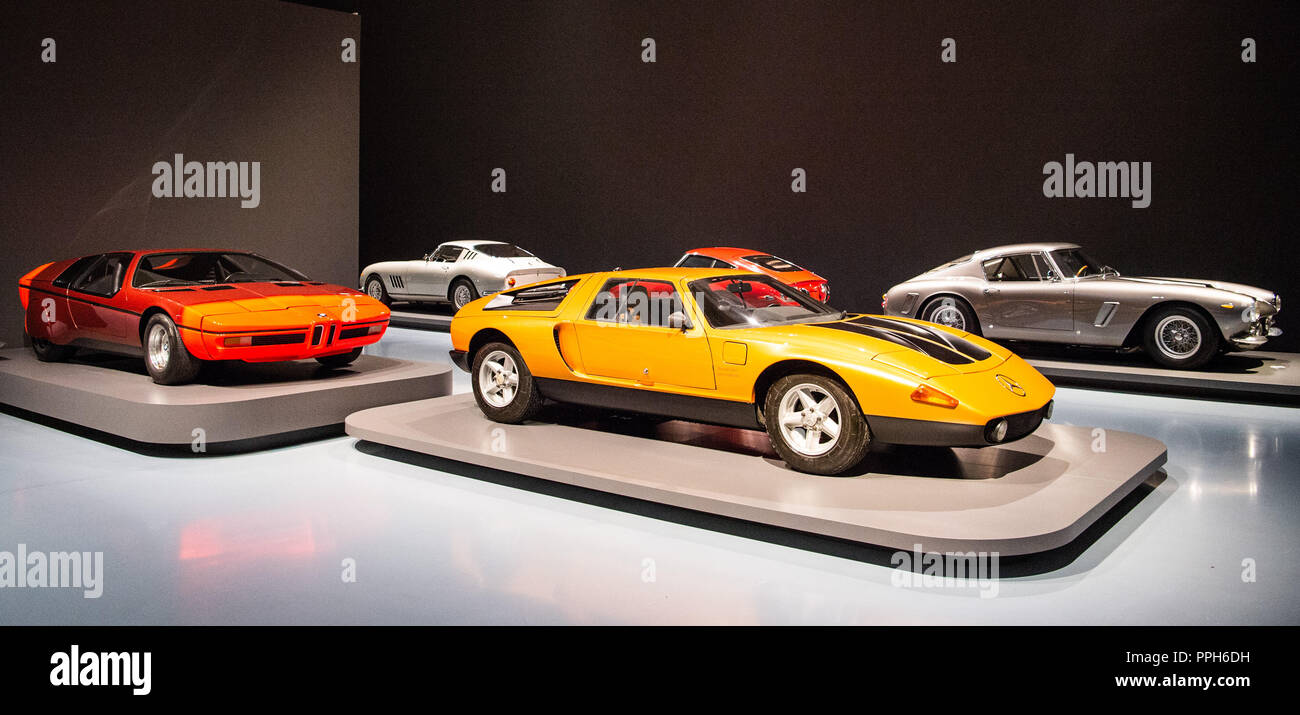 25 September 2018, North Rhine-Westphalia, Duesseldorf: A Mercedes-Benz C111 Type II Concept Auto (r) and a BMW Turbo (l) are on display with other sports cars in the exhibition 'PS: I love you' at the Museum Kunstpalast. In the exhibition about 30 sports cars of the 1950s to 1970s can be seen from 27.09.2018 to 10.02.2019. Photo: Christophe Gateau/dpa Stock Photo