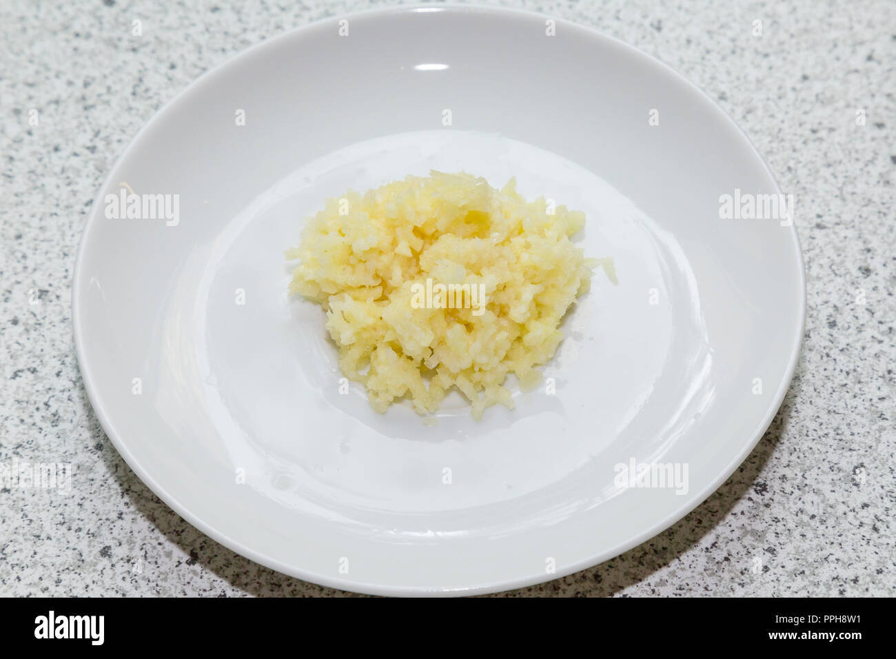 Cooking with garlic Stock Photo