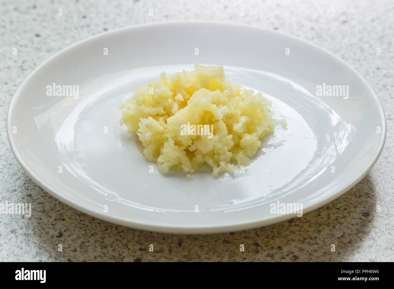 Cooking with garlic Stock Photo