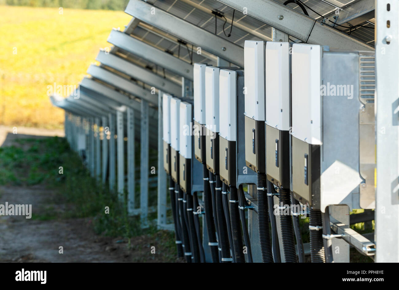 Inverters for solar photovoltaic modules using renewable solar energy.Alternative  electricity concept Stock Photo