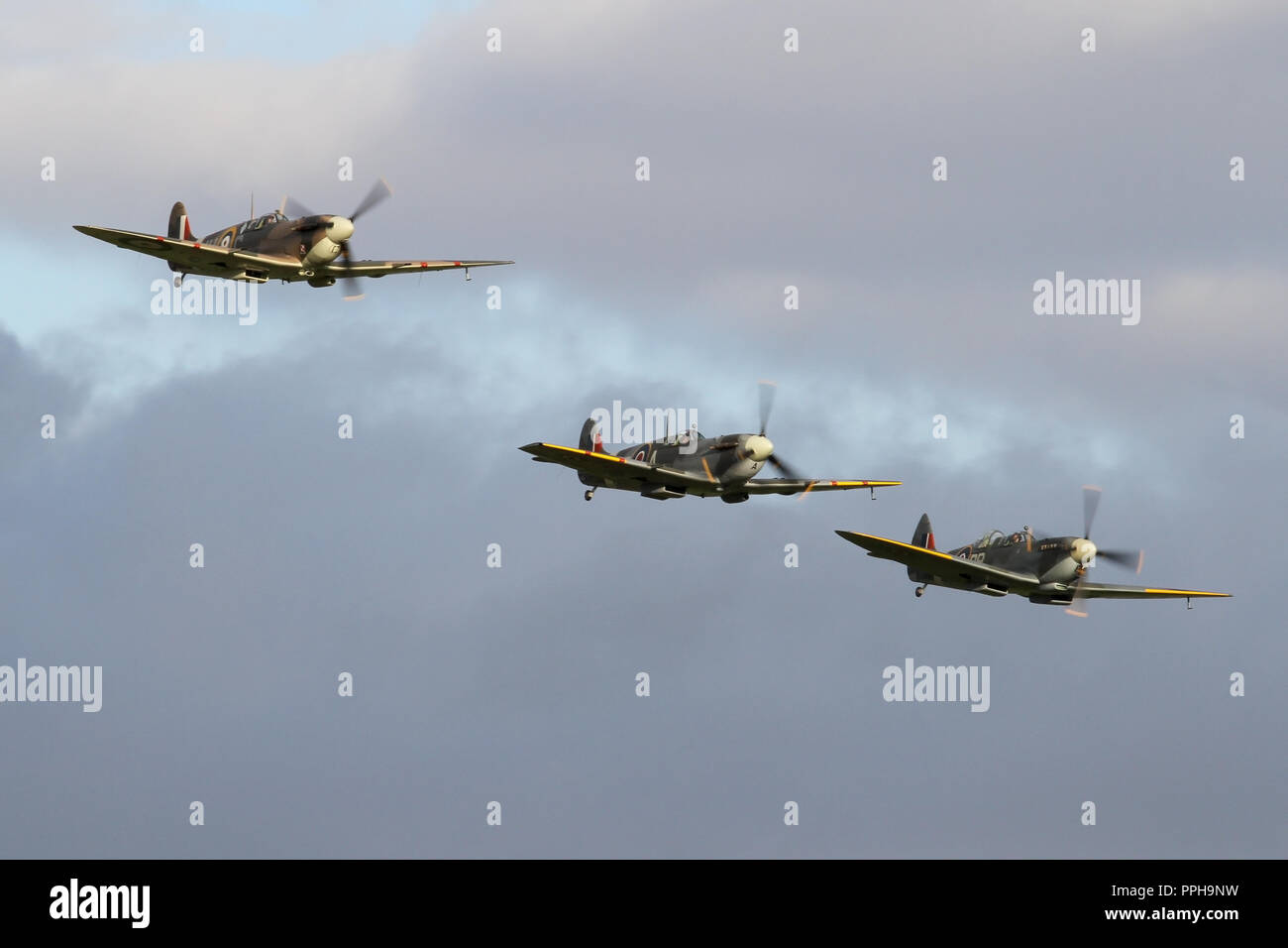 Formation flypast by three Supermarine Spitfires to conclude the September air show. Stock Photo