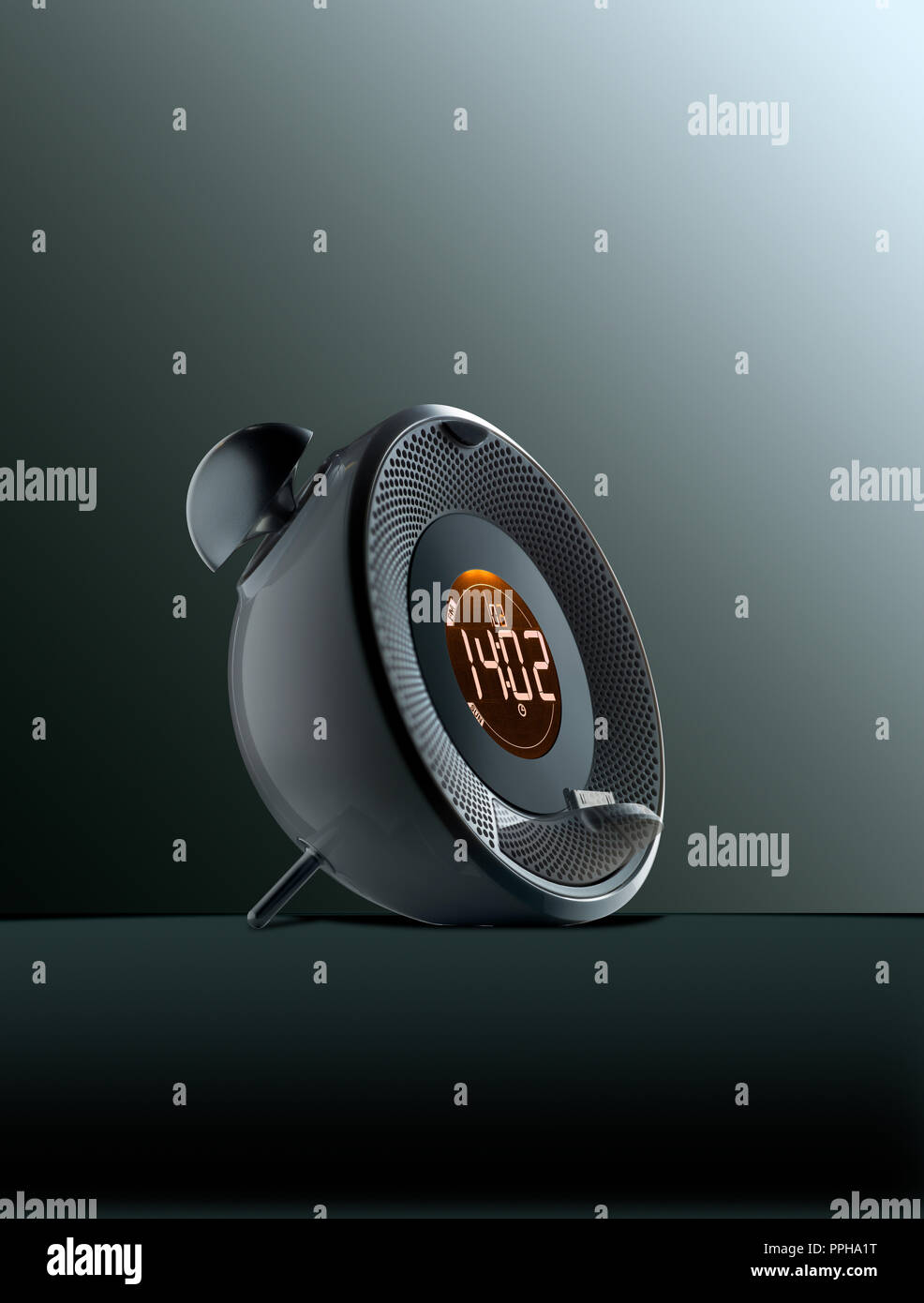 Modern Alarm Clock with Orange Digital  Display. Bells, Plug to connect  smartphone Stock Photo