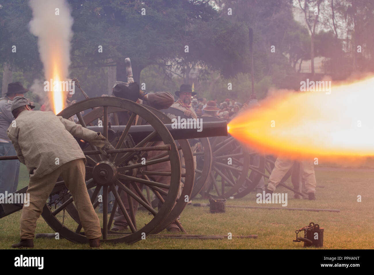 confederate soldiers firing a cannon during a battle at a American Civil war reenactment in Huntington Beach California USA Stock Photo