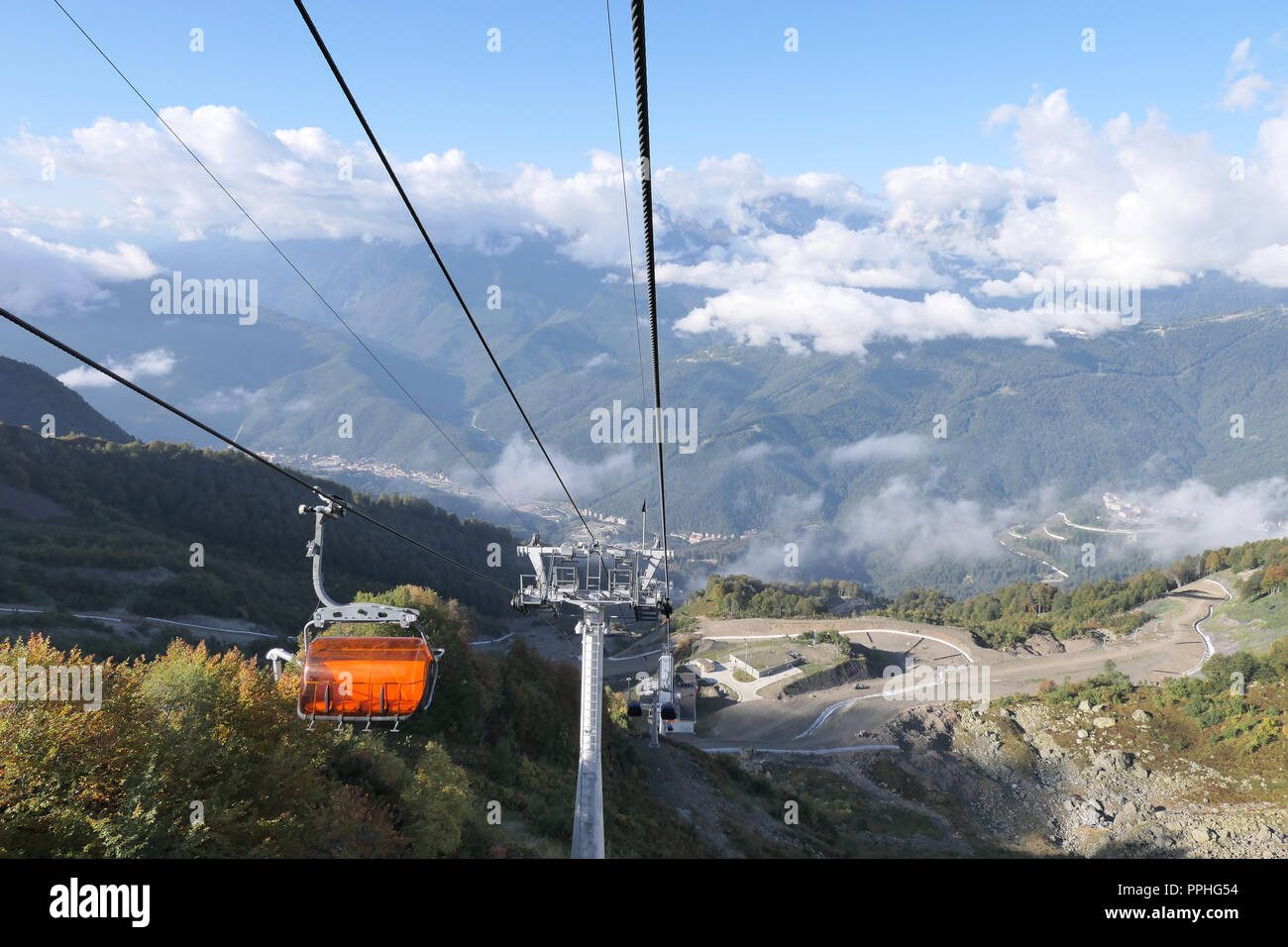 Cableway cabin riding on rope Stock Photo