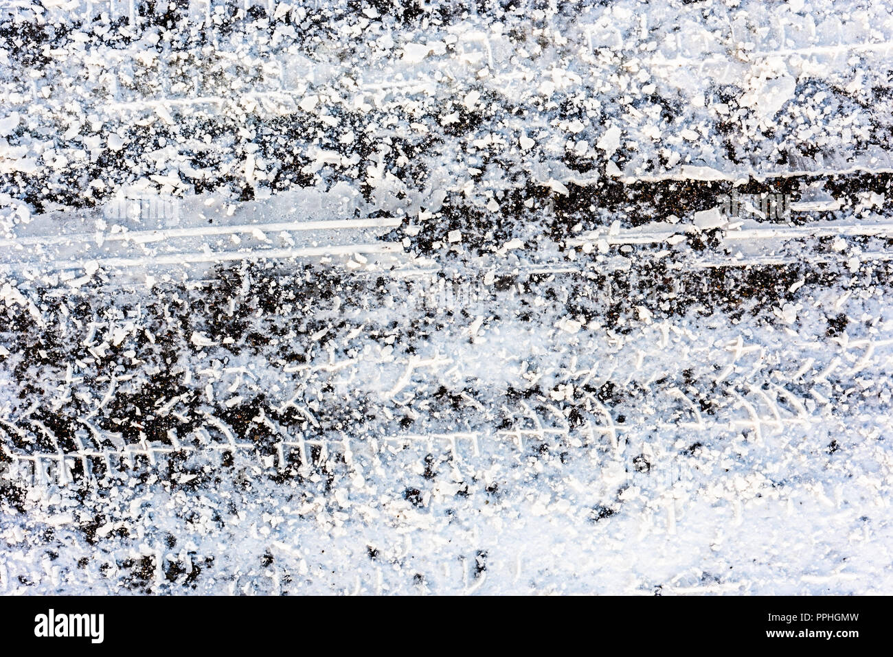Texture of road in winter, asphalt covered snow and tire tracks Stock ...