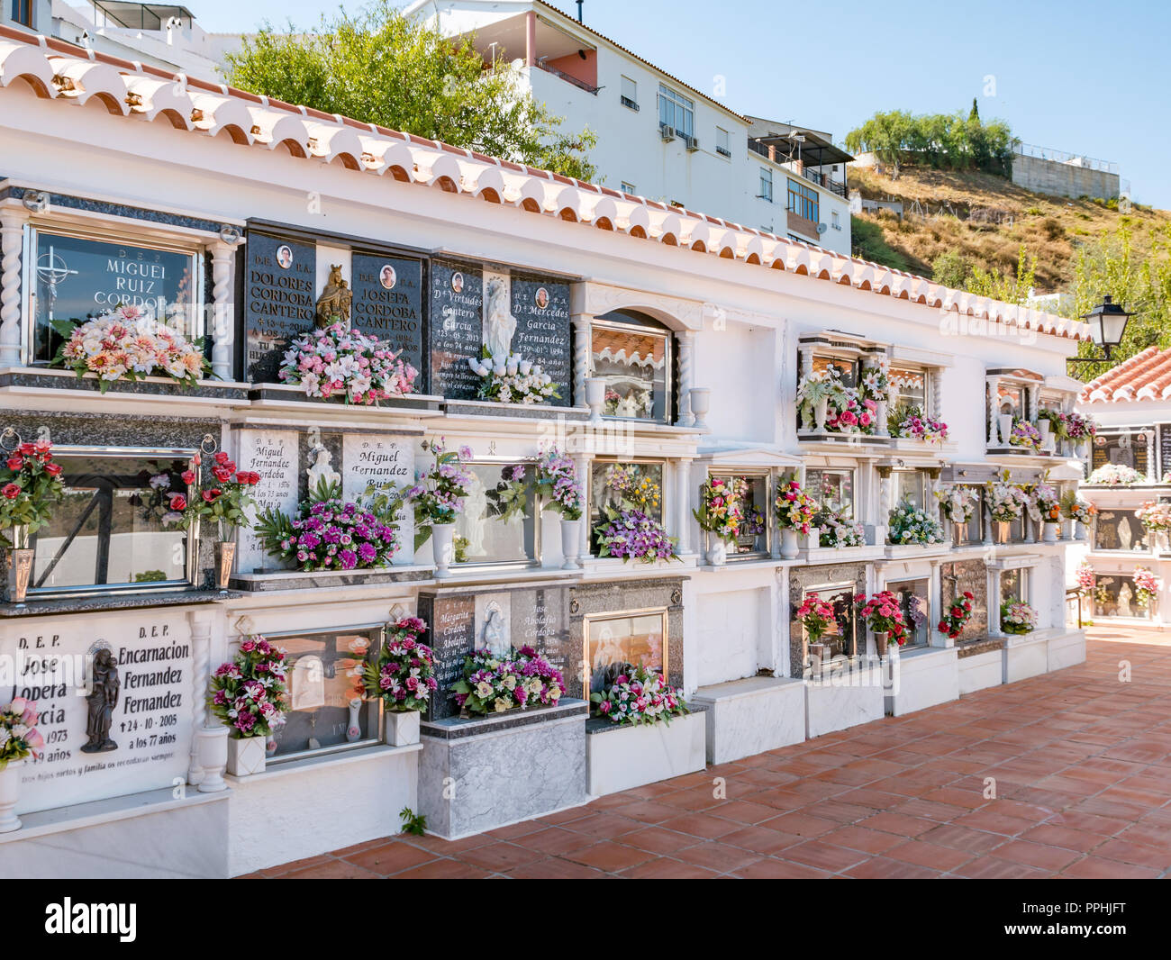 Catholic cemetery graves, mountain village of Corumbela, Axarquia, Andalusia, Spain Stock Photo