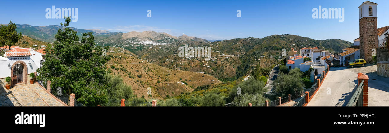 Panoramic Catholic cemetery and Arabic minaret converted to church tower, Corumbela, Axarquia, Andalusia, Spain and Canillas de Albaida in distance Stock Photo