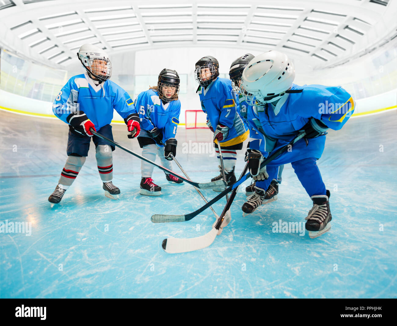 Children's ice hockey team practicing on rink Stock Photo Alamy