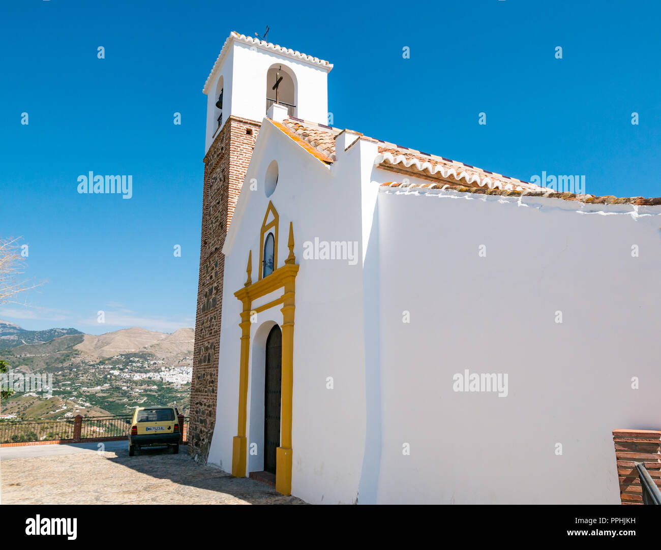 Saint Peter Catholic church with Arabic minaret converted to bell tower, Corumbela, Axarquia, Andalusia, Spain Stock Photo