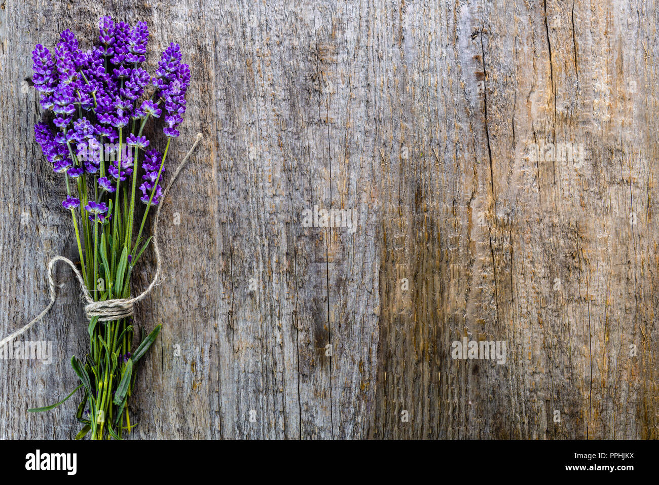 Lavender flowers, bouquet on rustic wooden background, top view Stock