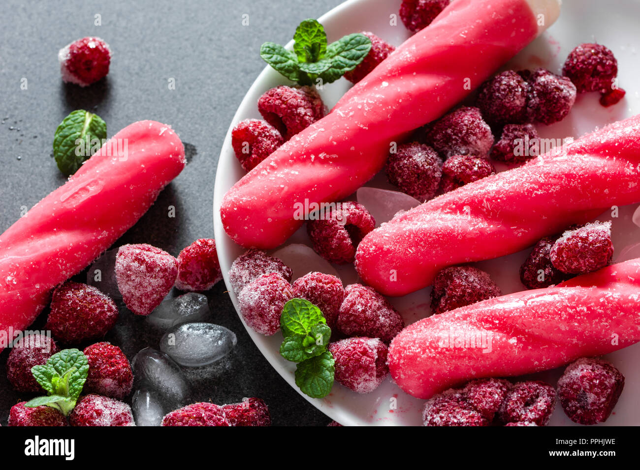 Flavored ice on a stick, cold popsicles, summer snack Stock Photo