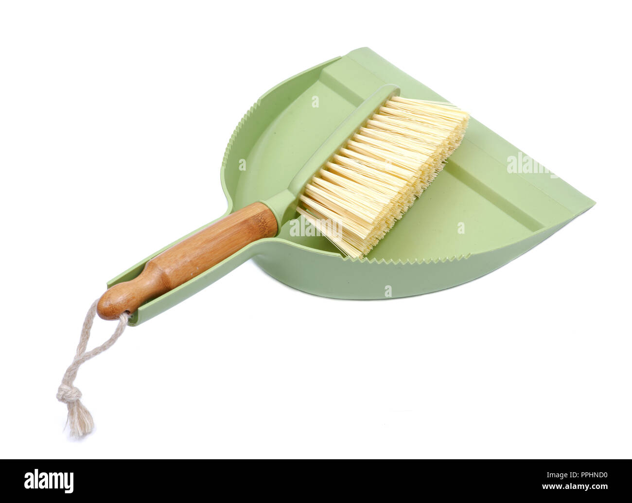 Green dustpan and natural bamboo broom set isolated on white background Stock Photo