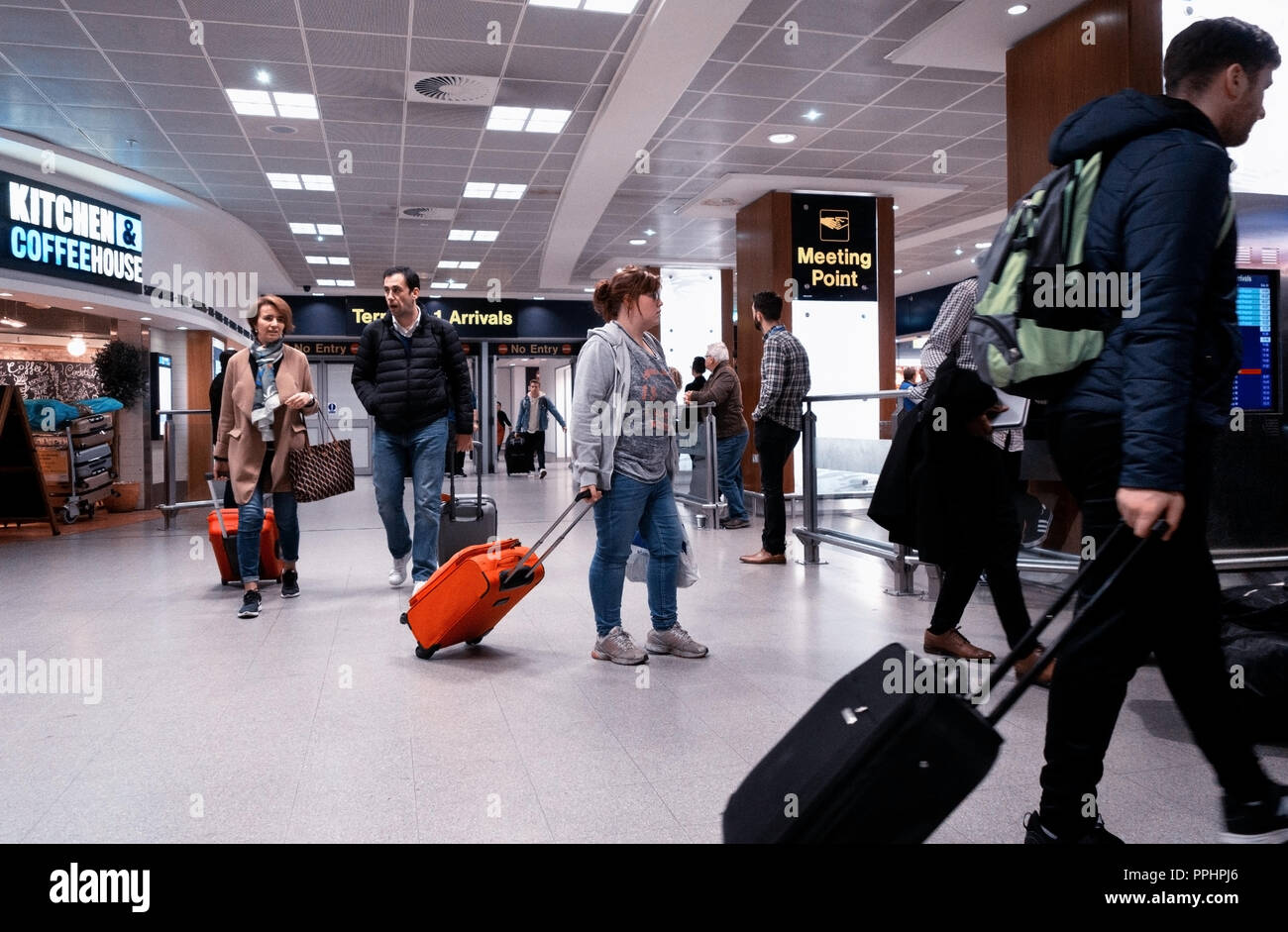 Manchester International Airport T1 arrival hall with passengers ...