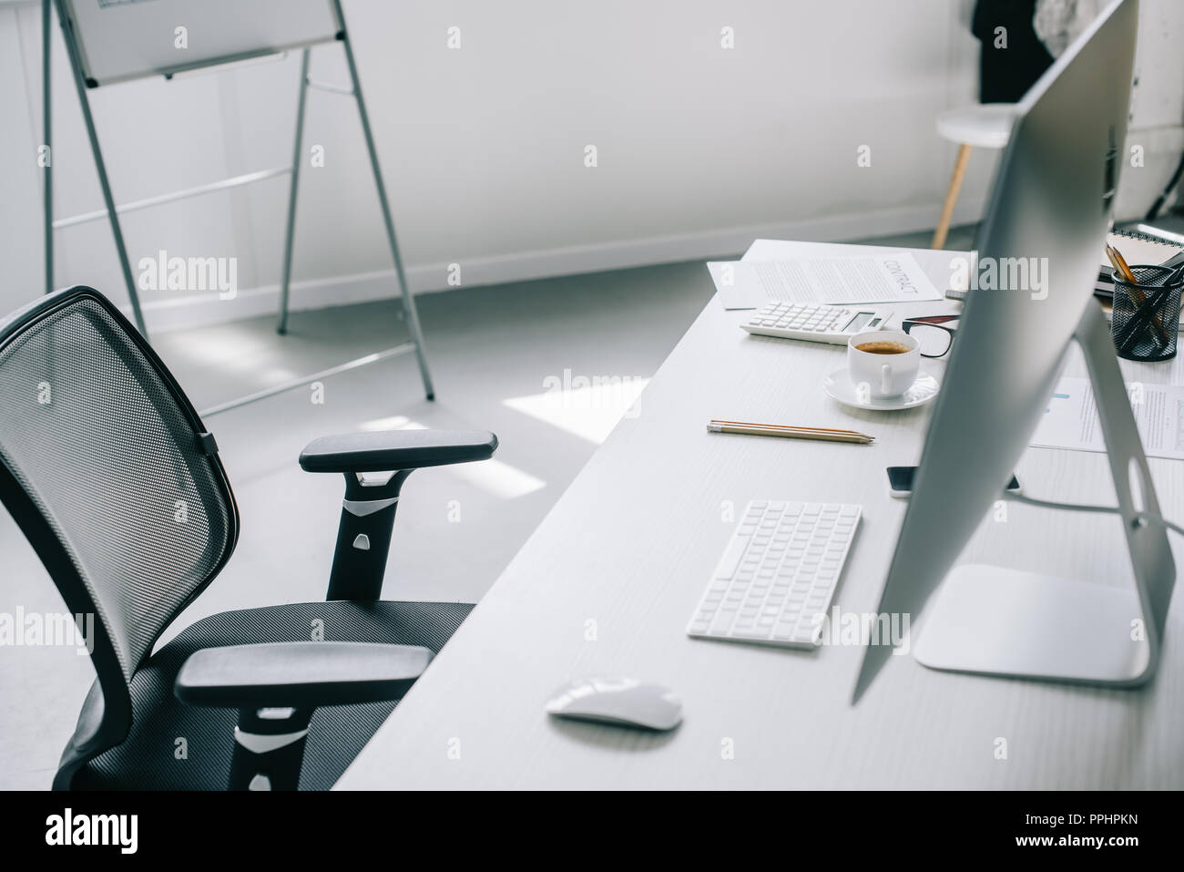 computer, table and chair in light modern office Stock Photo - Alamy