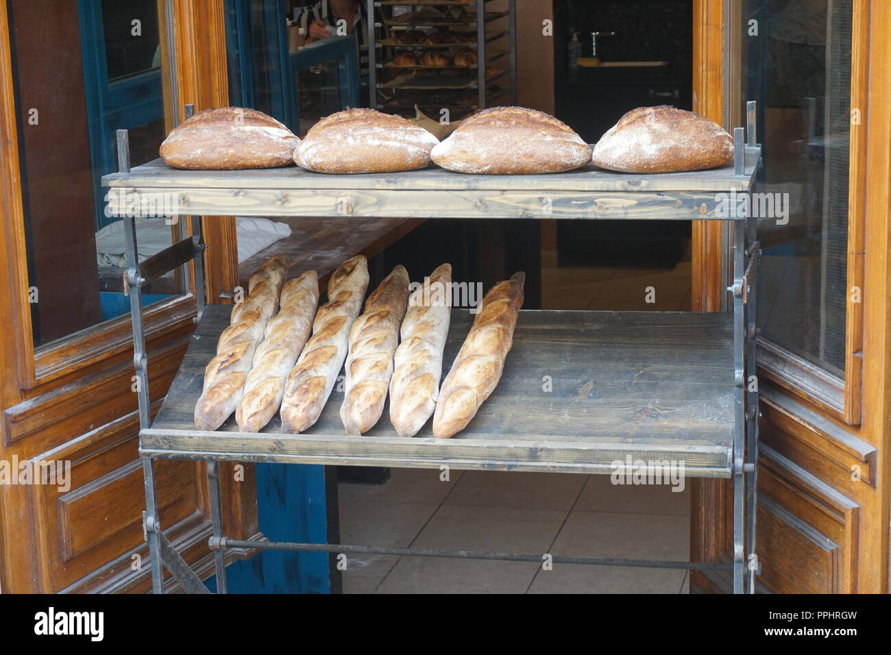 Bread cooling outside a small baker's shop Stock Photo