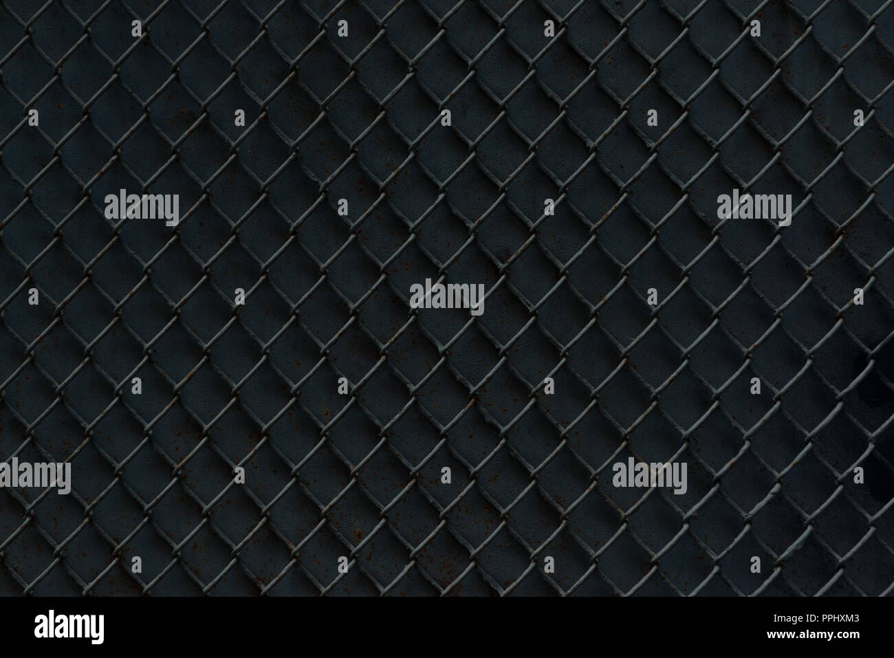 metal fence on black background, full frame view Stock Photo - Alamy